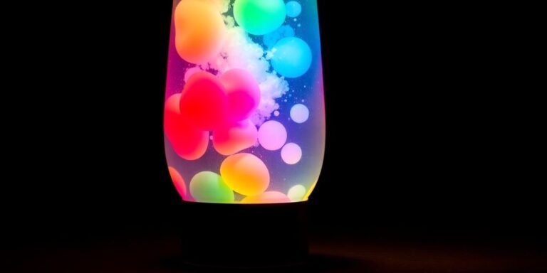 Homemade lava lamp with colorful wax blobs suspended in liquid.