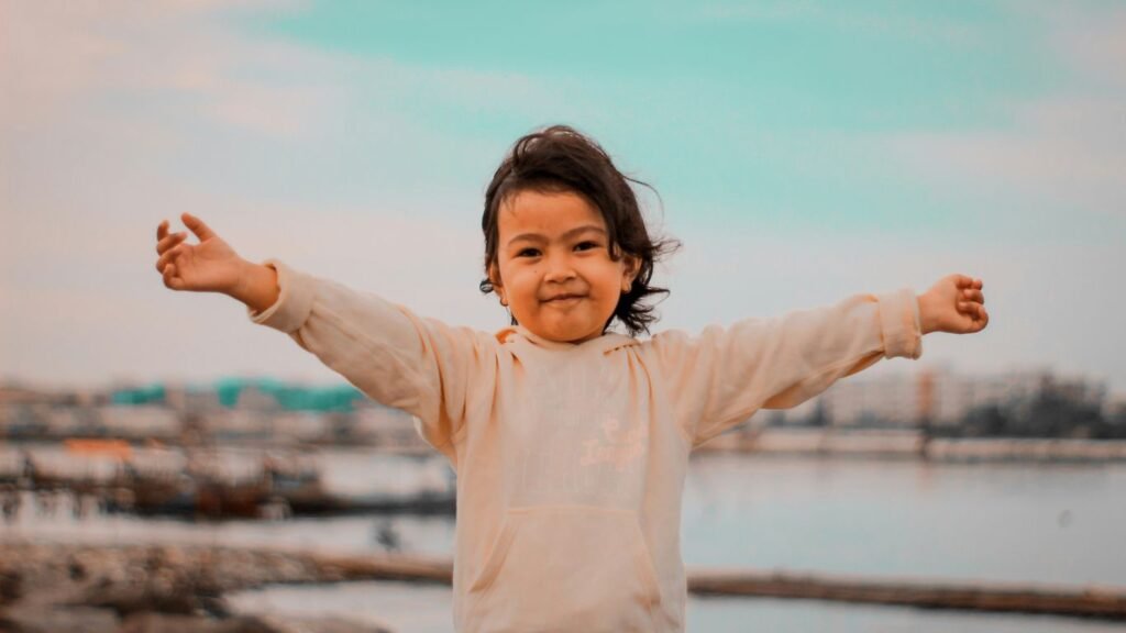 a child standing on a railing